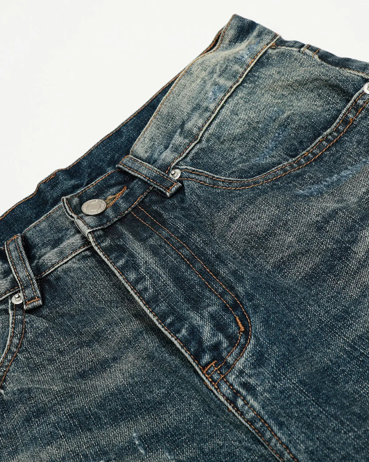 Blue vintage distressed baggy jeans from Flation Streetwear, featuring a relaxed fit and worn-in denim style.
