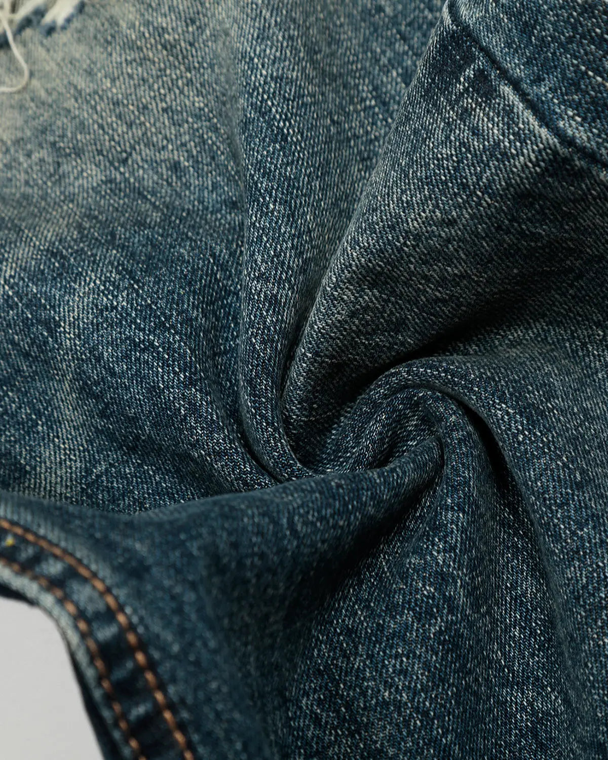 Blue vintage distressed baggy jeans by Flation Streetwear with a relaxed fit and worn-in style.