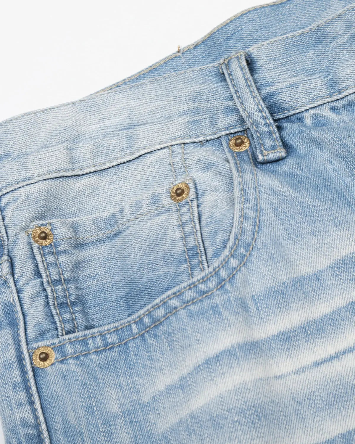 Vintage Flation whiskered bootcut jeans in blue denim, showing classic fit and distressed details for streetwear style.