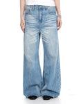 Blue vintage whiskered bootcut jeans by Flation Streetwear, showcasing classic denim style with a relaxed fit and faded detailing.
