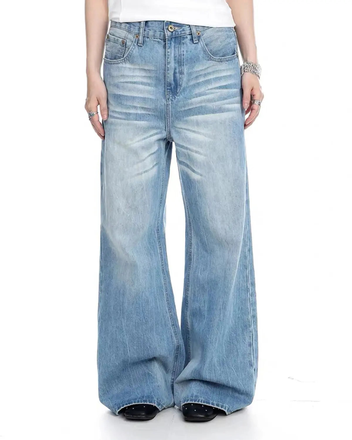 Blue vintage whiskered bootcut jeans by Flation Streetwear, showcasing classic denim style with a relaxed fit and faded detailing.
