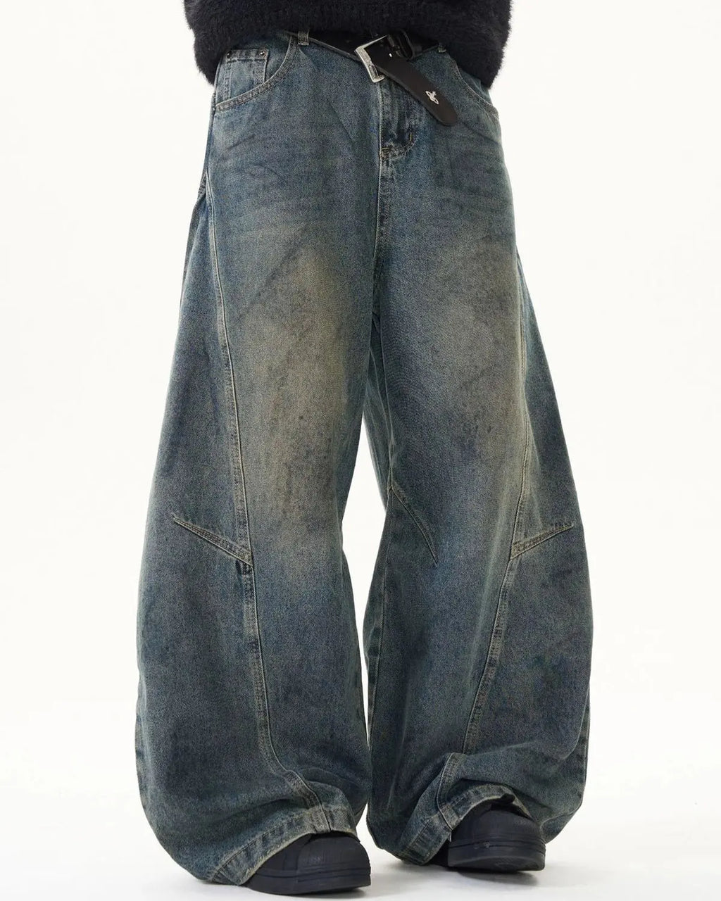 Light blue washed deconstructed barrel jeans from Flation Streetwear, showing distressed details and relaxed fit.