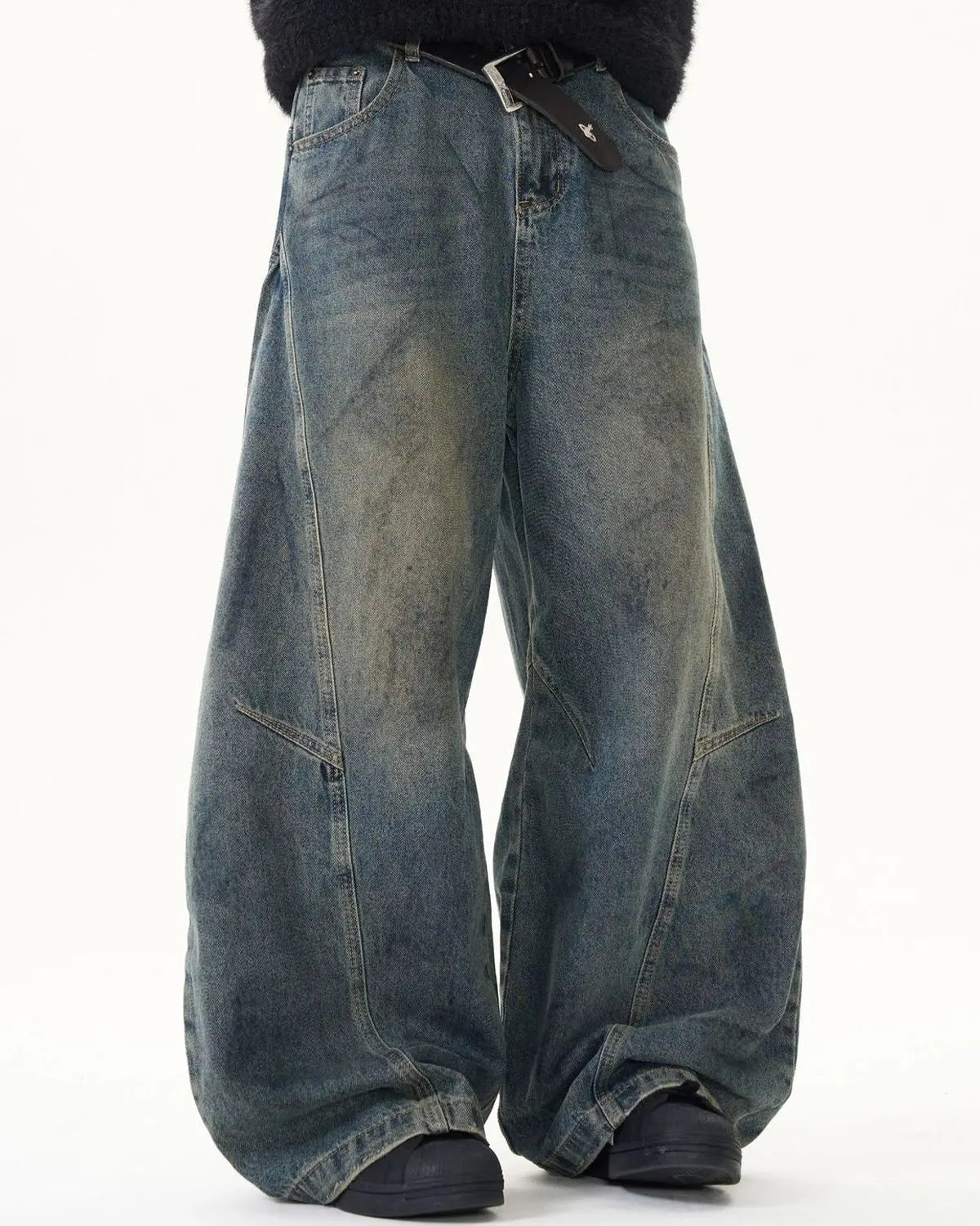 Light blue washed deconstructed barrel jeans from Flation Streetwear, showing distressed details and relaxed fit.