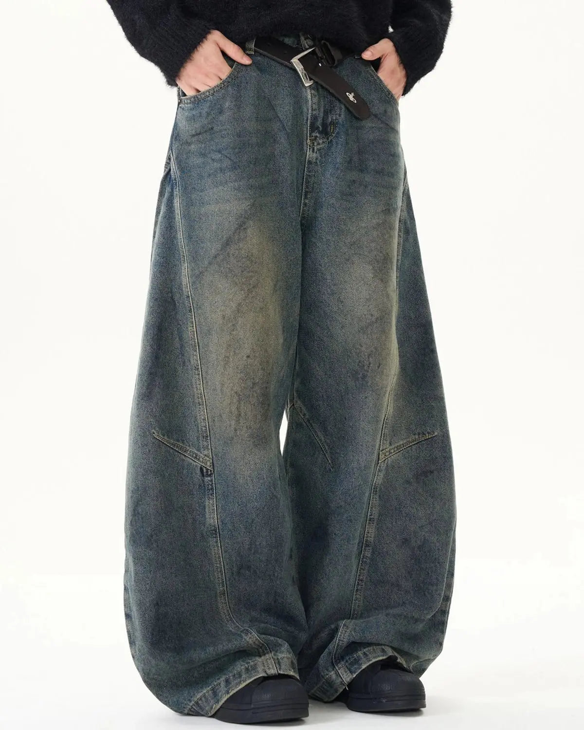 Blue washed deconstructed barrel jeans by Flation Streetwear, featuring a relaxed fit and distressed details.