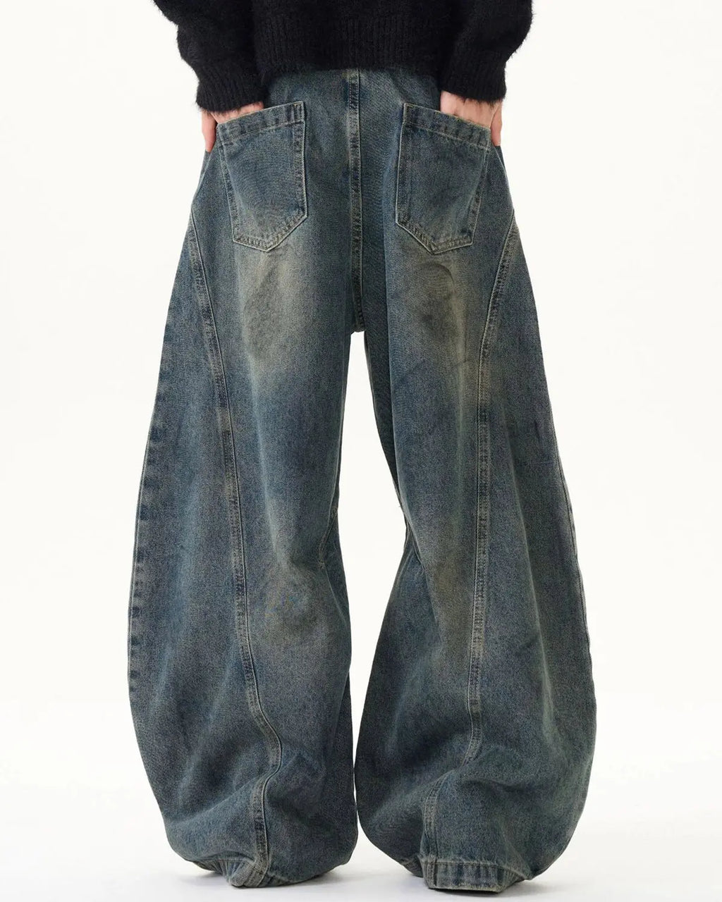 Blue washed deconstructed barrel jeans by Flation Streetwear, featuring a relaxed fit and distressed details.