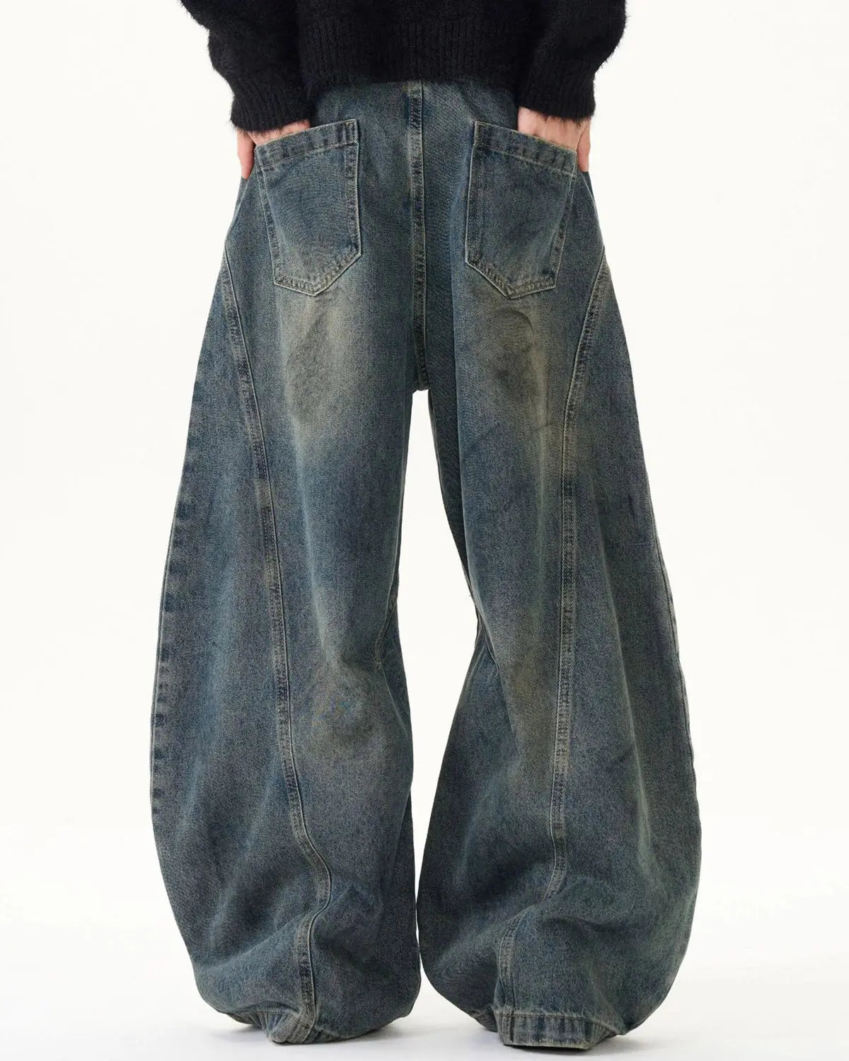Blue washed deconstructed barrel jeans by Flation Streetwear, featuring a relaxed fit and distressed details.