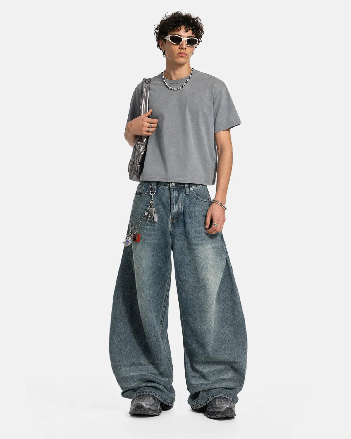 Blue acid-washed barrel jeans from Flation Streetwear featuring whisker detailing, styled with a relaxed fit and modern street fashion.