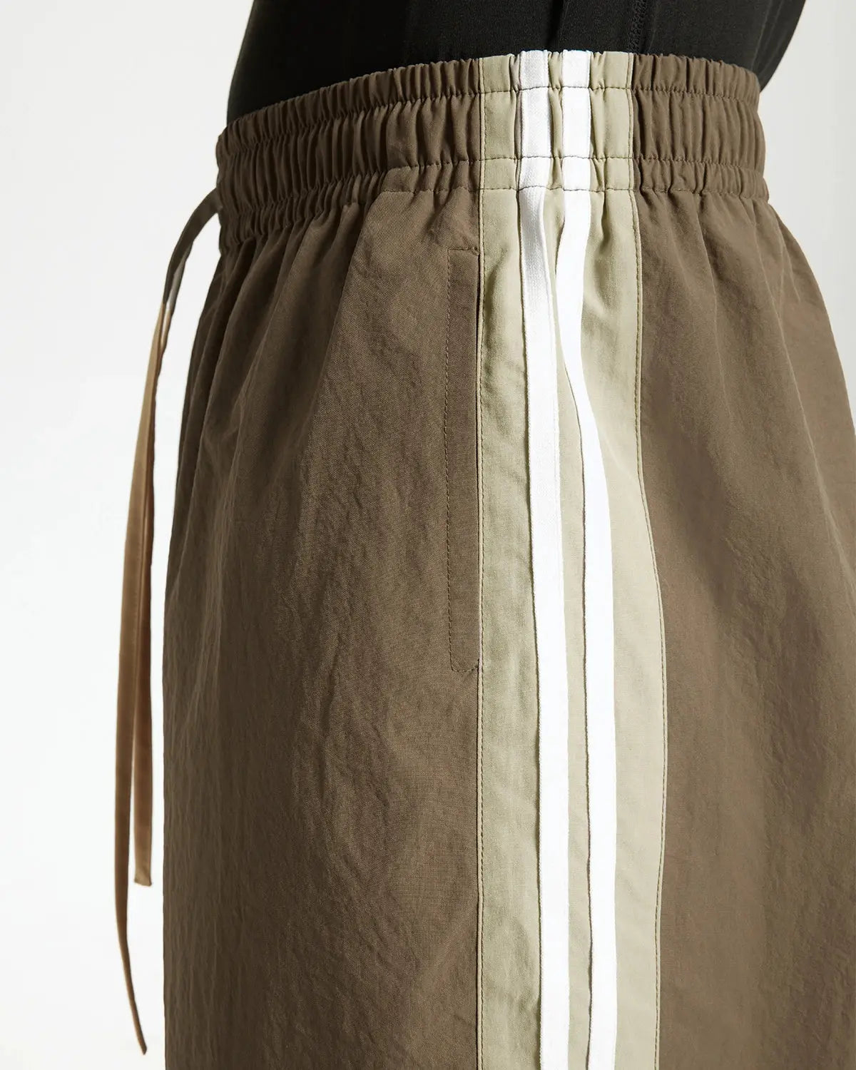 Brown striped casual pants by Flation Streetwear, featuring a relaxed fit and stylish striped pattern for everyday wear.