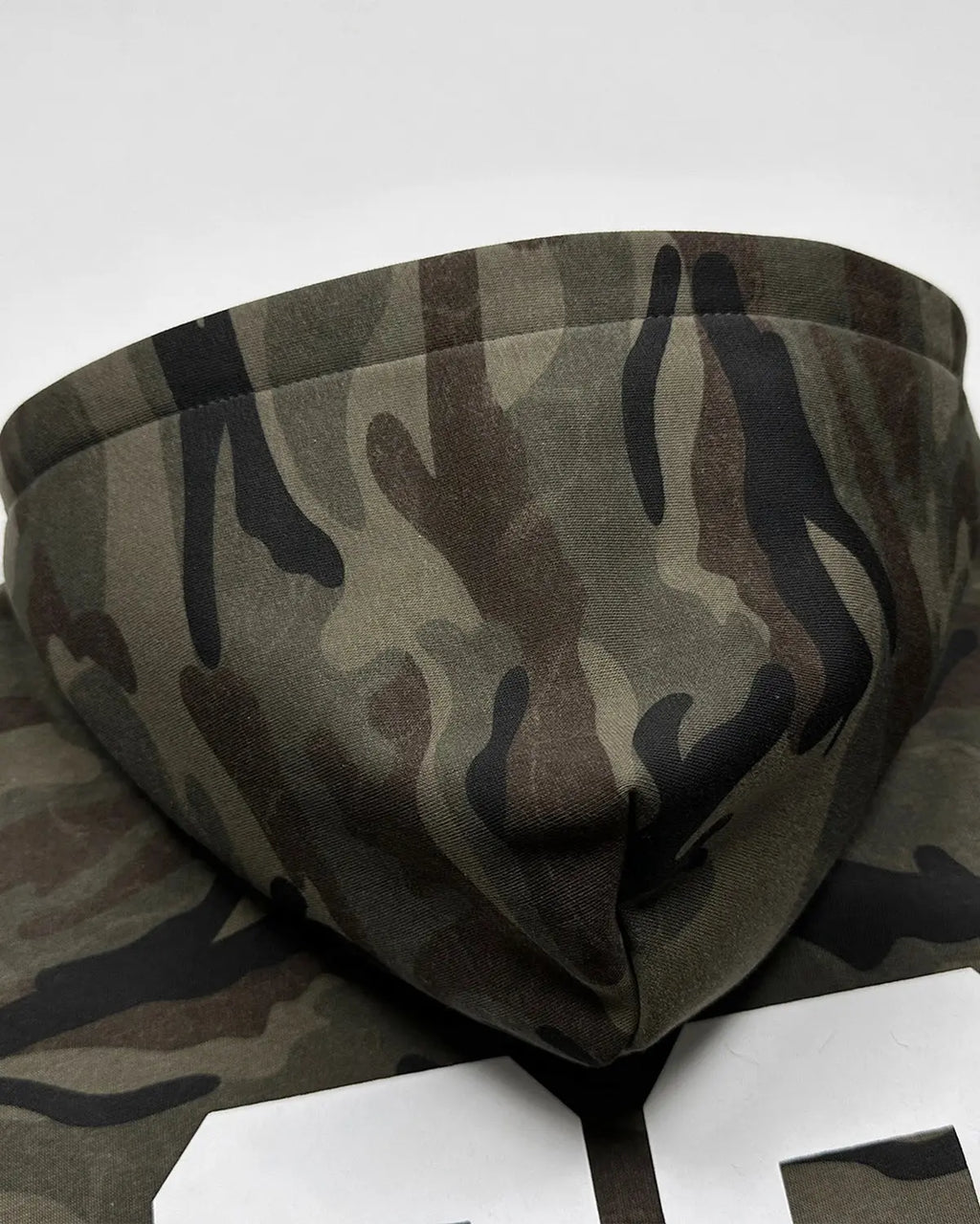 Camo zip-up hoodie with 69 applique embroidery, made by Flation Streetwear, featuring a front zipper and camouflage pattern.