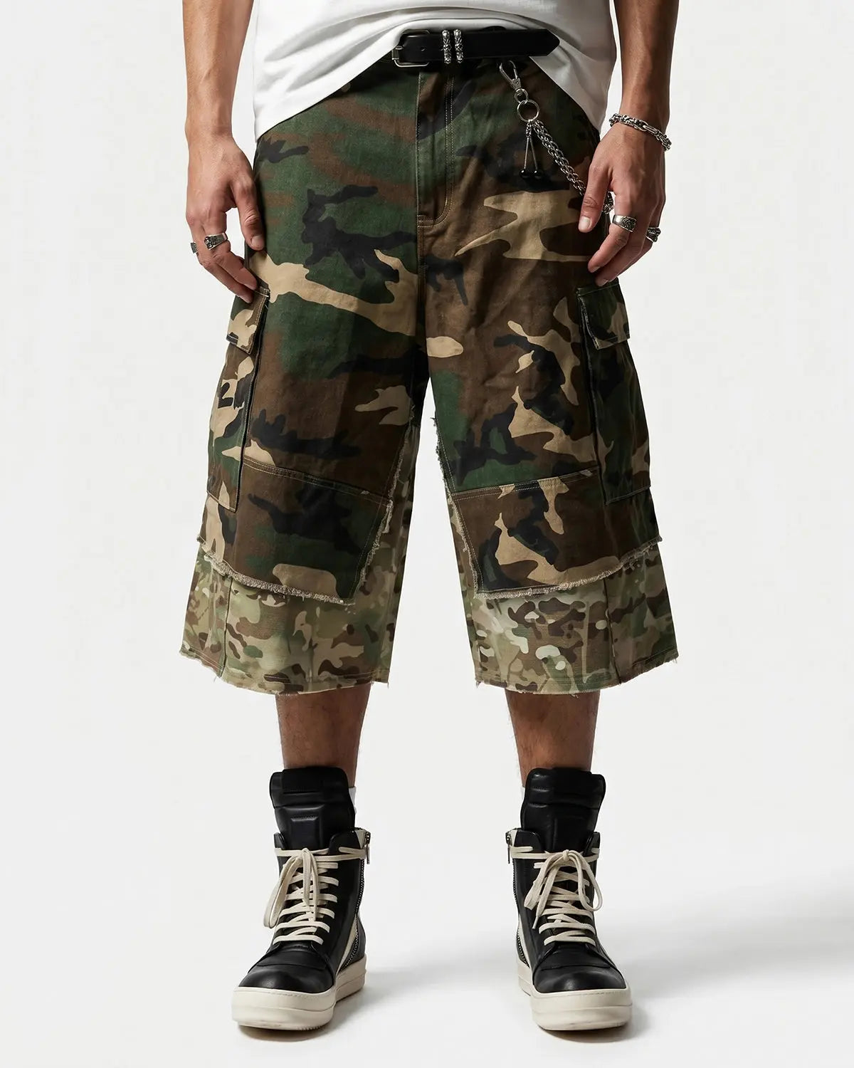Camo layered longline jorts by Flation Streetwear featuring a relaxed fit and distressed denim design.