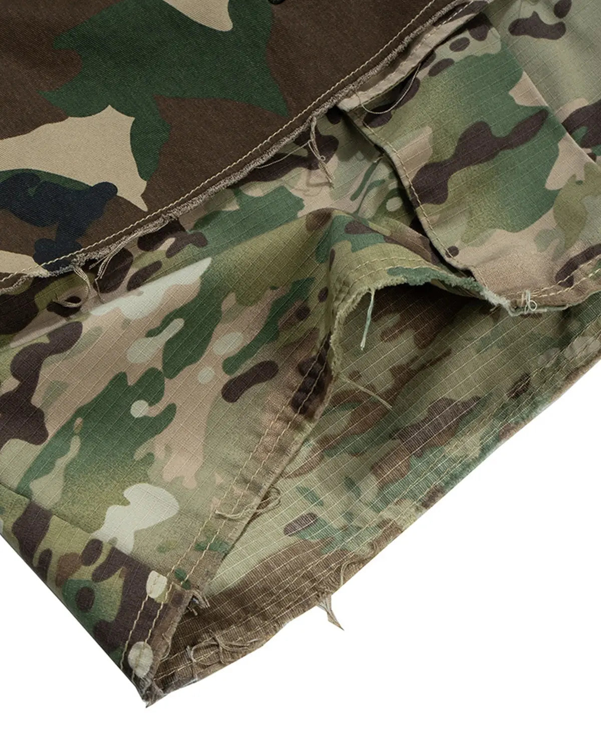 Camo layered longline jorts by Flation Streetwear, featuring a relaxed fit and camouflage pattern with distressed detailing.
