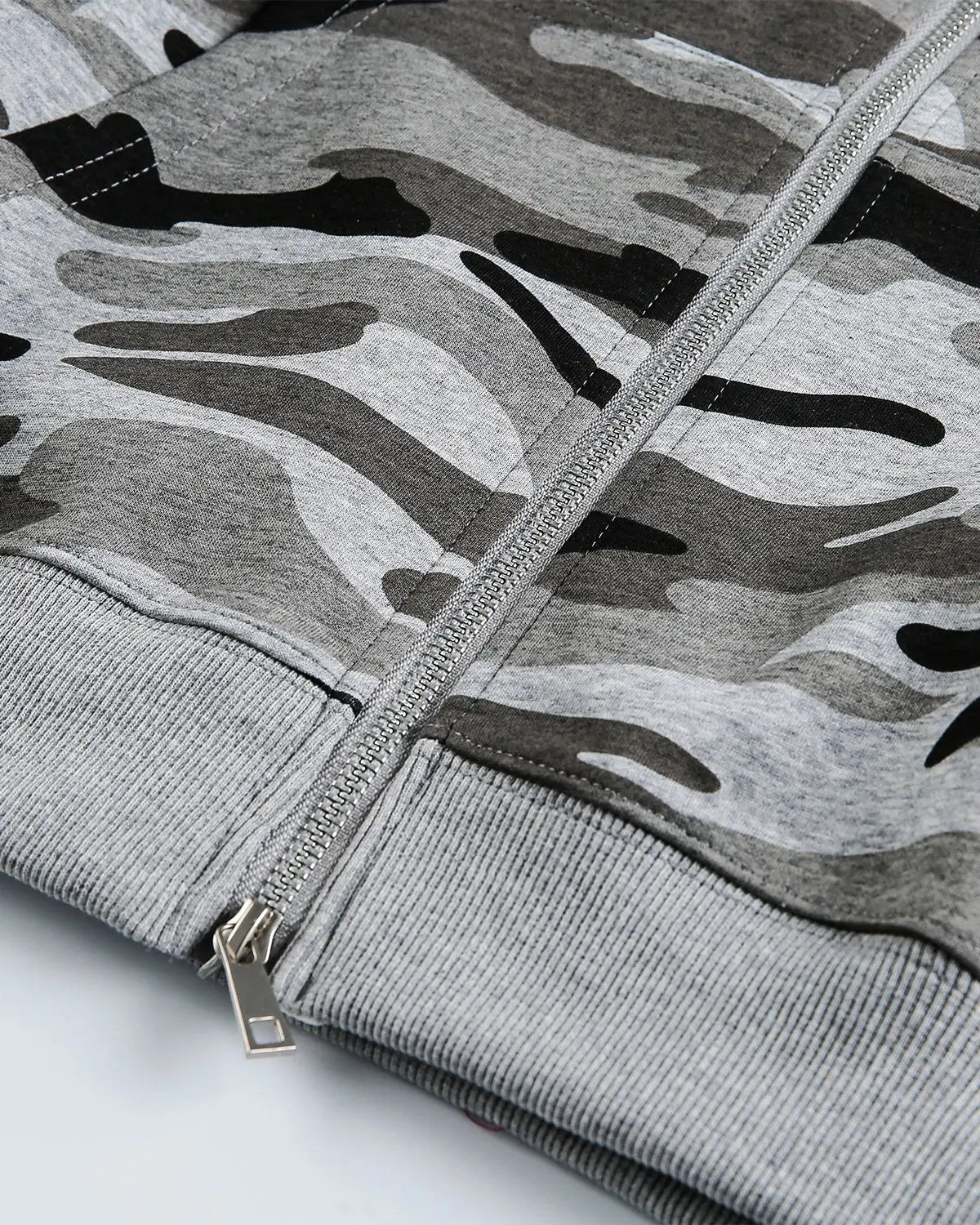 Cropped camouflage zip-up hoodie by Flation Streetwear, featuring a green and brown camo pattern and a front zipper.