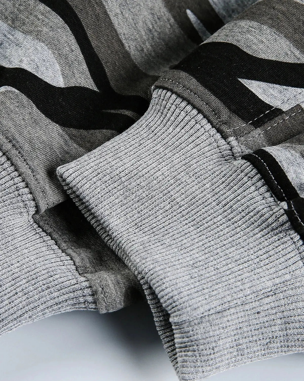 Cropped camouflage zip-up hoodie by Flation Streetwear, featuring a green and brown camo pattern and front zipper closure.