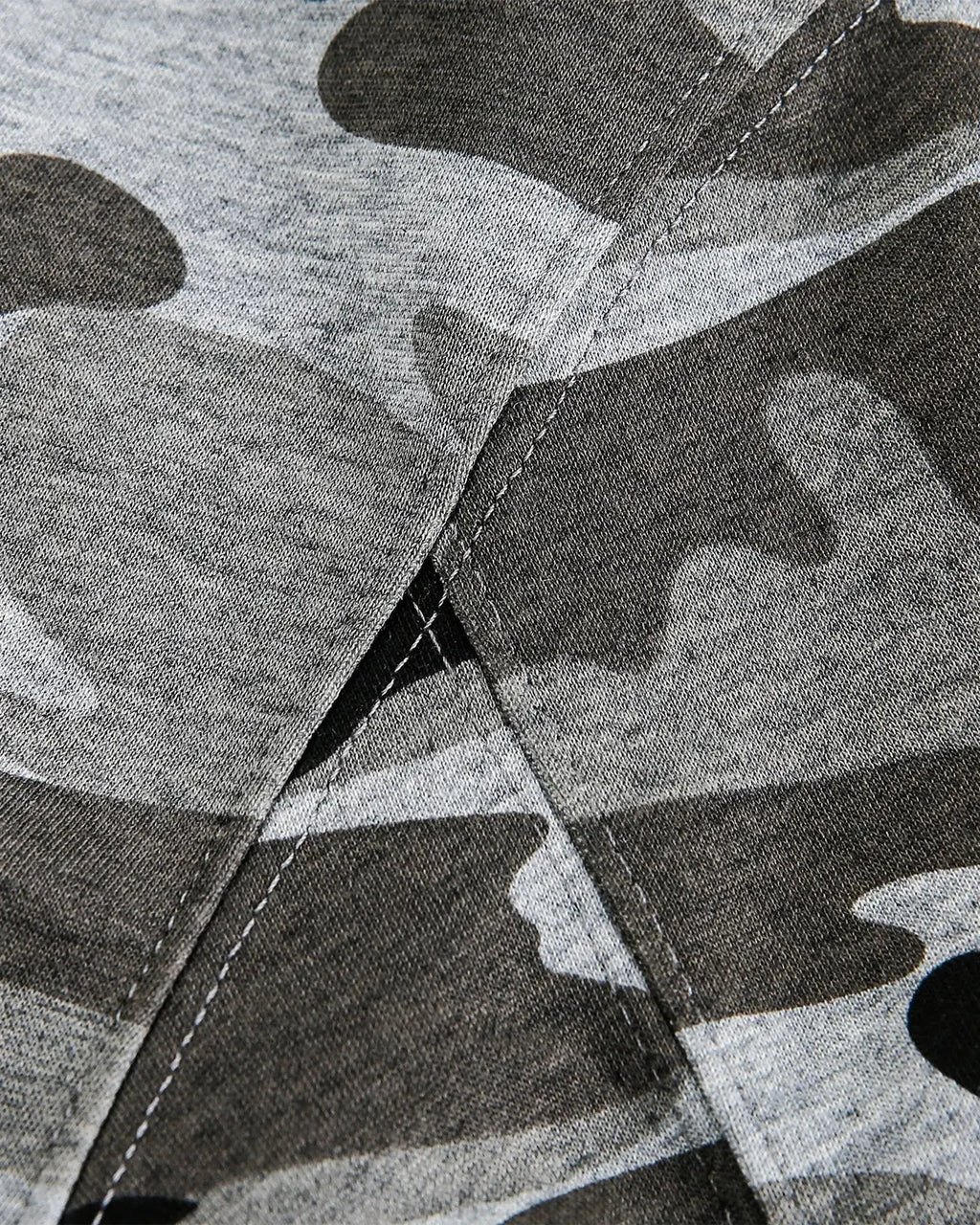 Cropped camouflage zip-up hoodie by Flation Streetwear featuring a green and black camo pattern and front zipper closure.