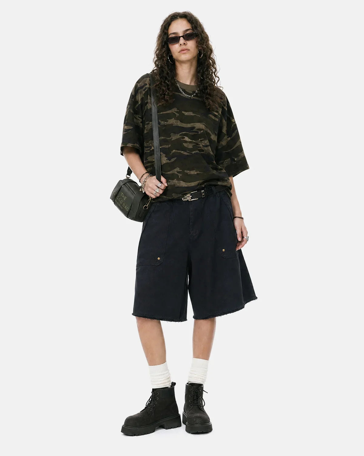 Frayed hem camo knee-length shorts by Flation featuring a stylish camo pattern and casual streetwear design.