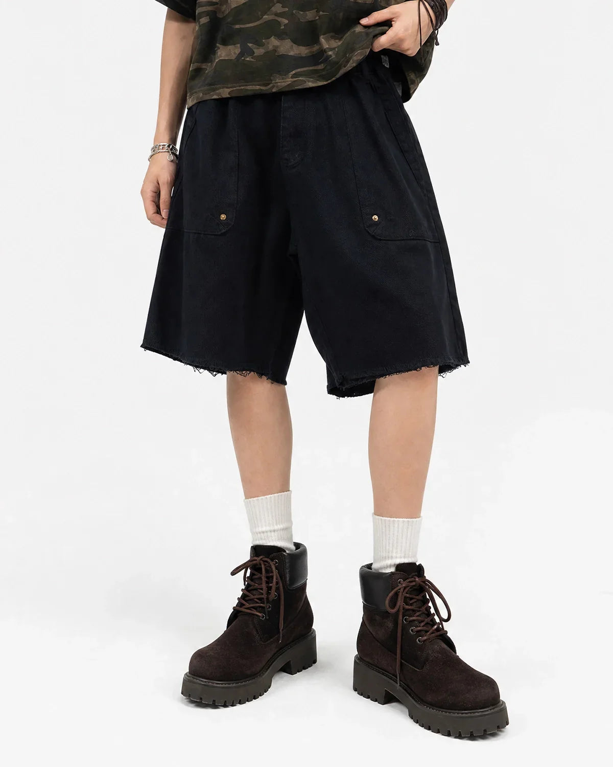 Frayed hem camo knee-length shorts by Flation Streetwear featuring a rugged camo pattern and casual frayed hem detail.
