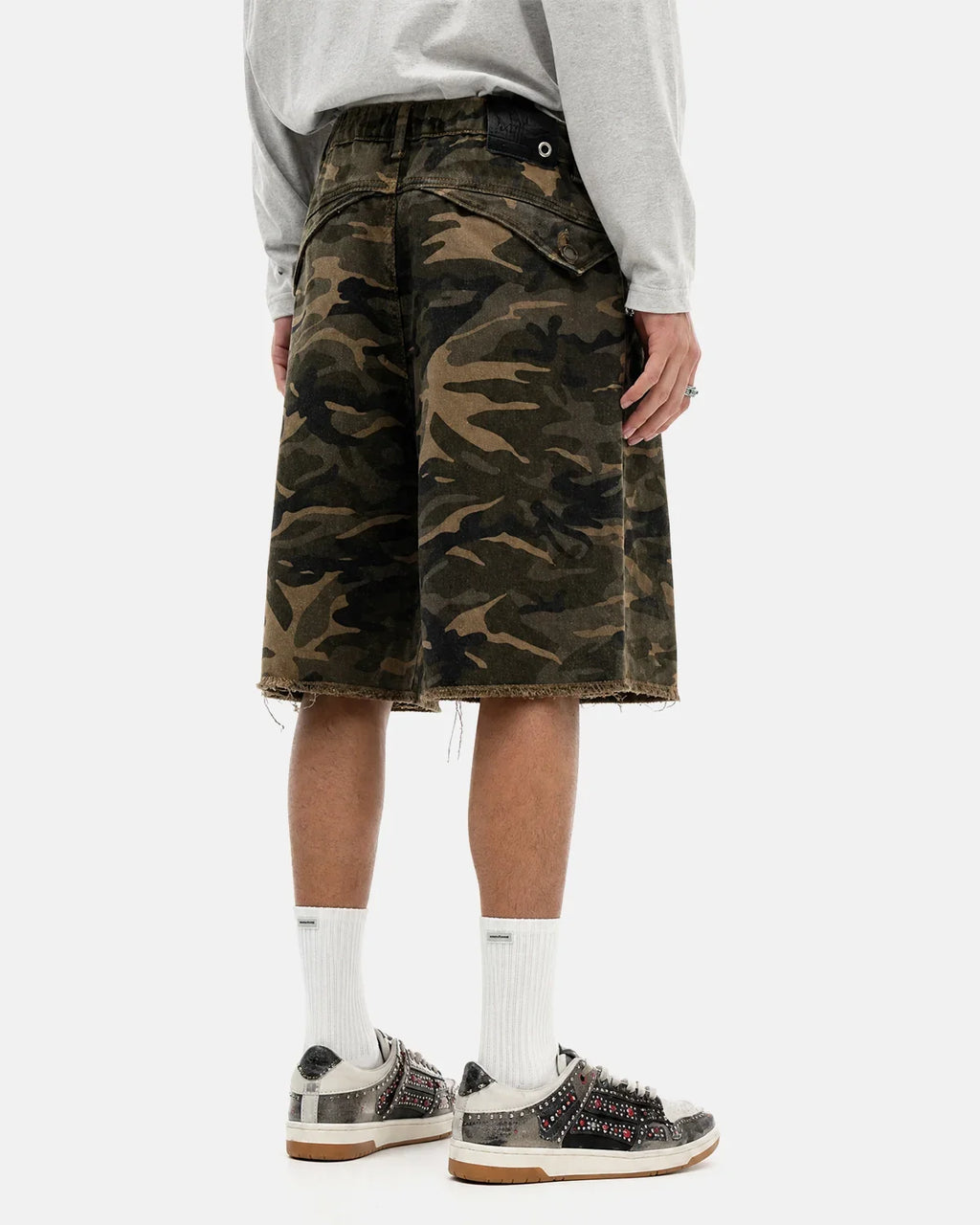 Front view of Flation Streetwear frayed hem camo knee-length shorts with a rugged, casual style and classic camouflage pattern.