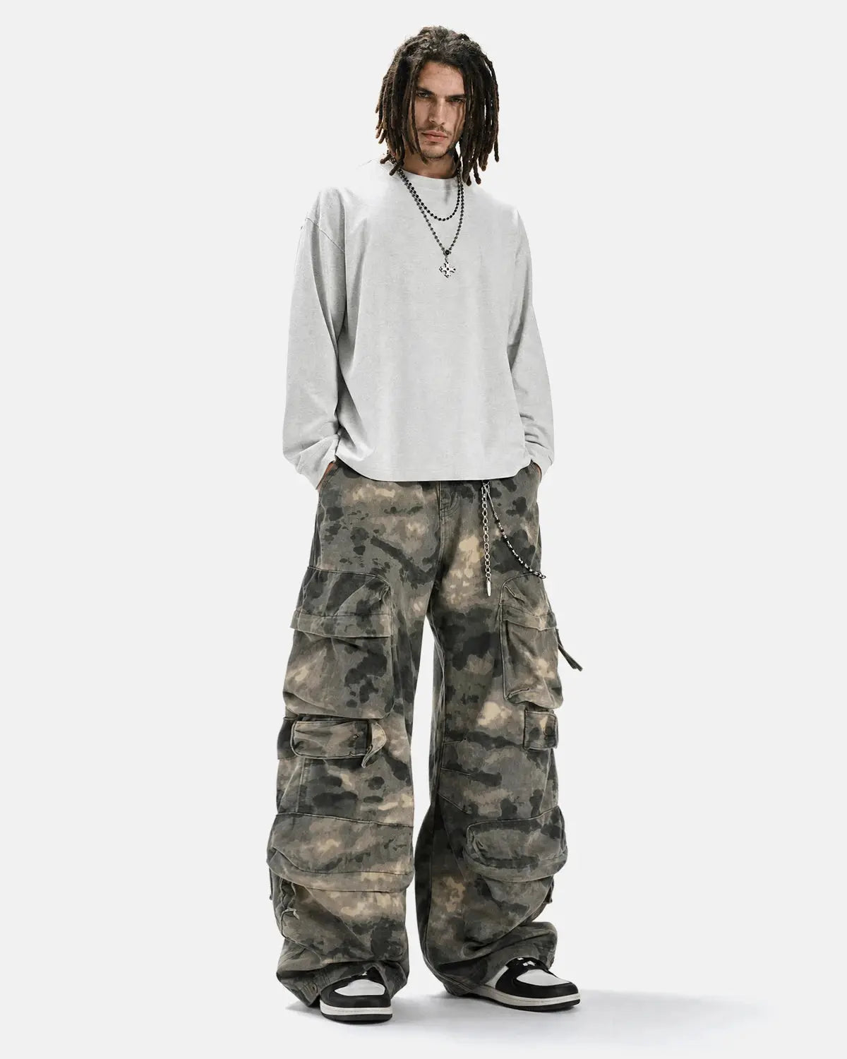Camo multi-pocket baggy cargo pants by Flation Streetwear with relaxed fit and multiple utility pockets.