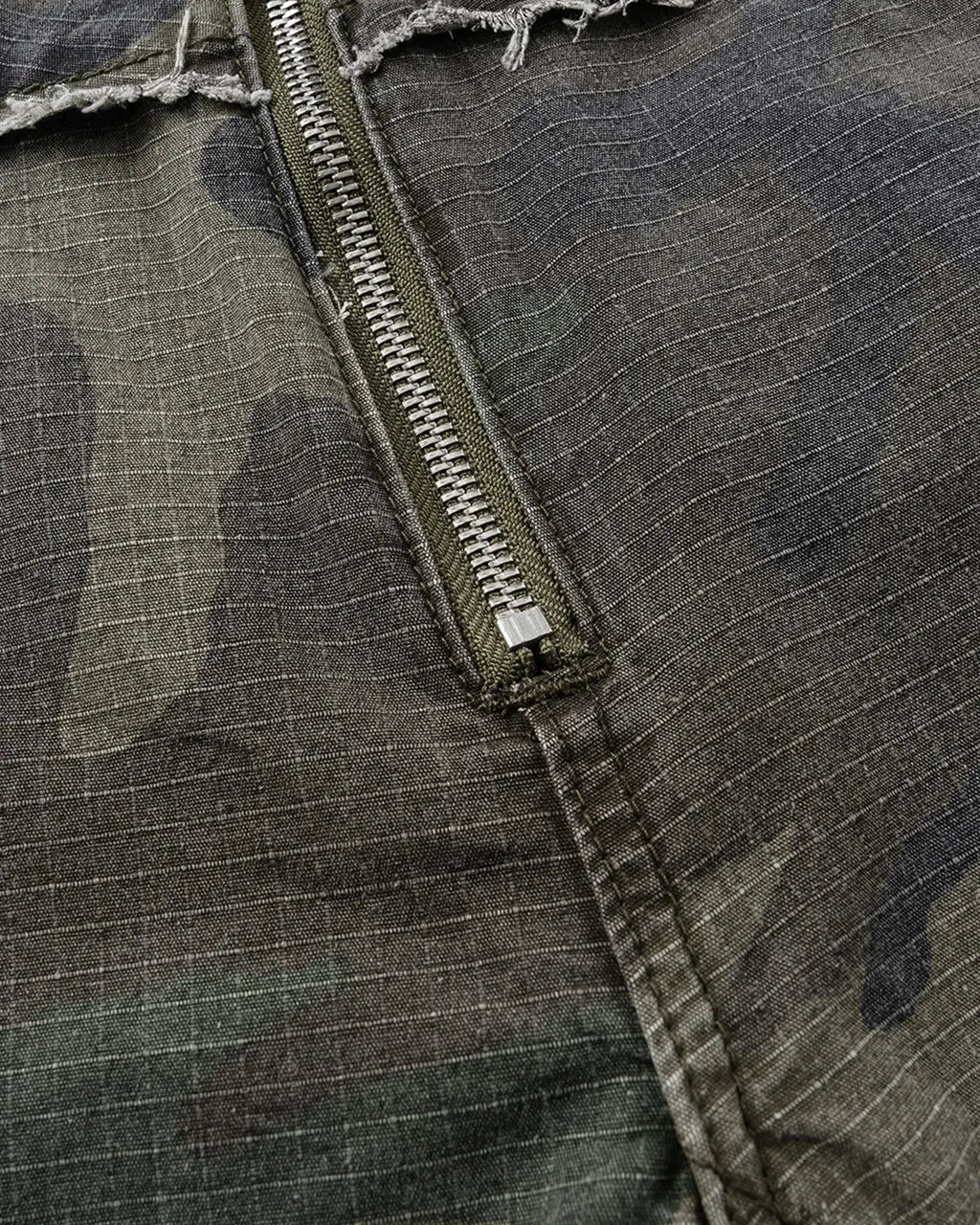 Camo utility longline shorts by Flation Streetwear featuring a camouflage pattern, multiple pockets, and a relaxed fit.