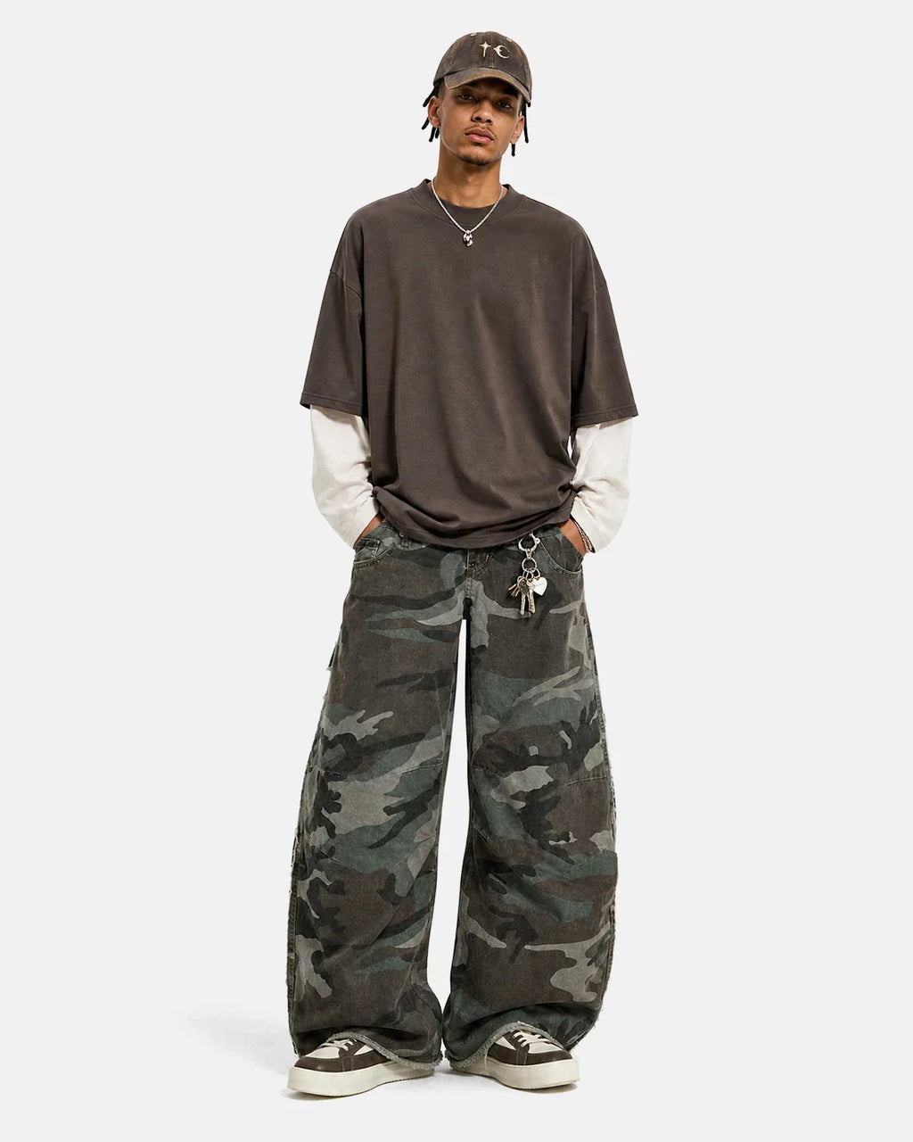 Double waist camo cargo pants by Flation Streetwear featuring a relaxed fit and military-style camo pattern.