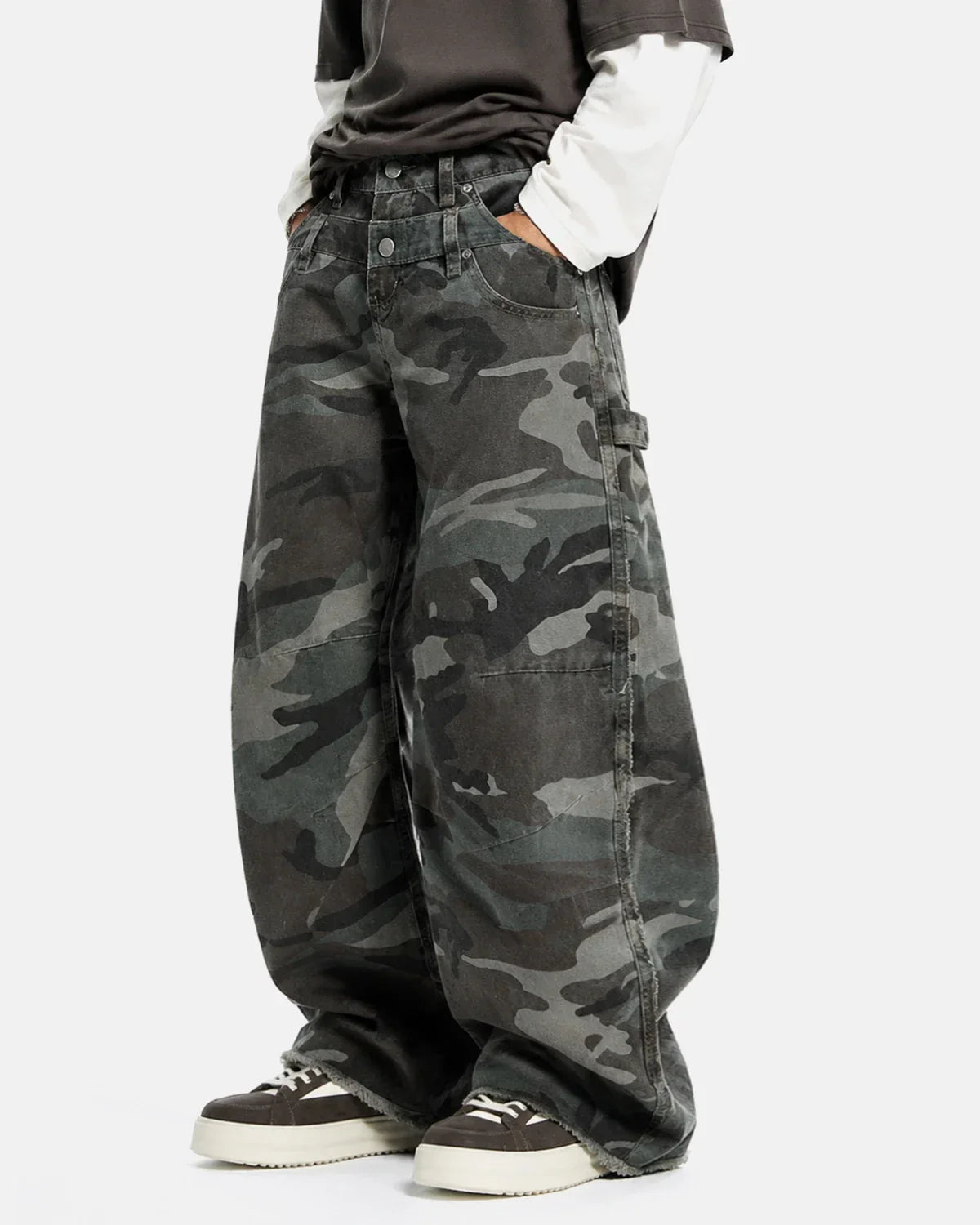 Double waist camo cargo pants by Flation Streetwear featuring a green and black camouflage pattern and multiple cargo pockets.