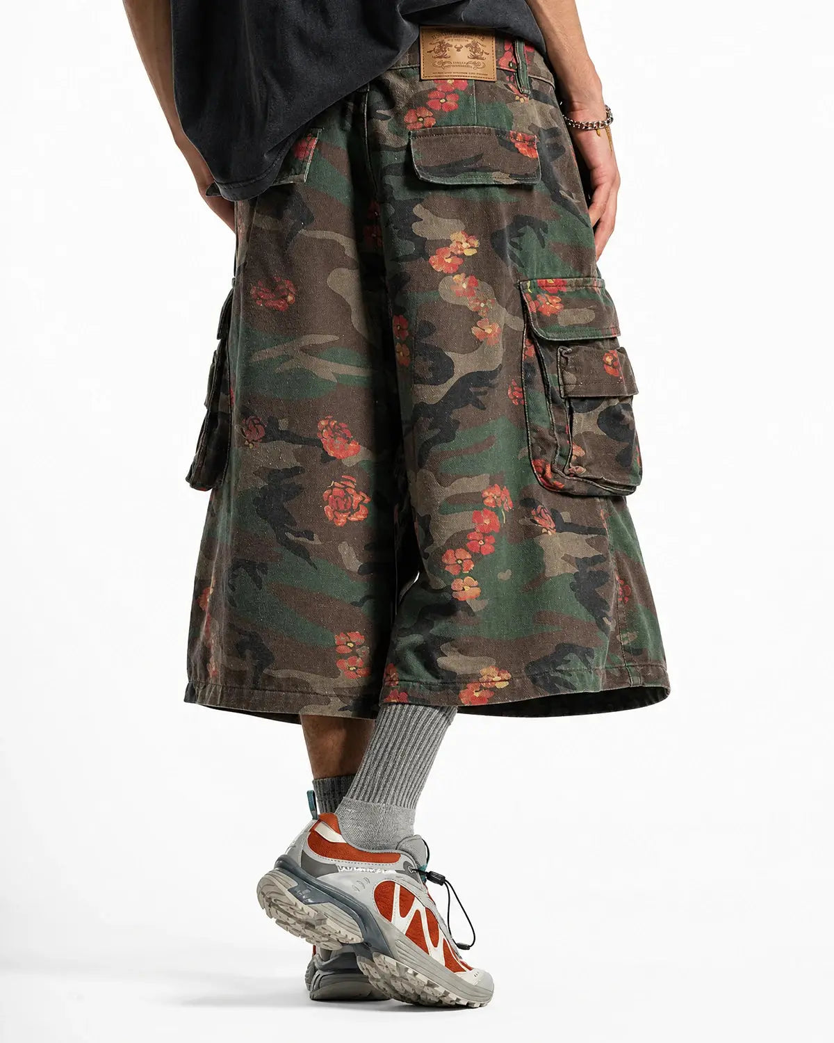 Flation Floral Camo Cargo Longline Shorts featuring a floral camo pattern, relaxed fit, and cargo pockets for streetwear style.