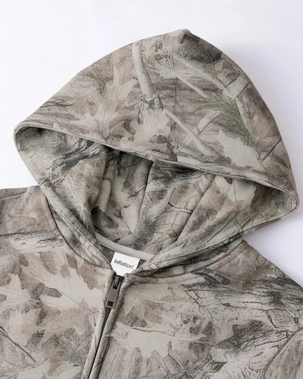 Realtree camo zip-up hoodie by Flation Streetwear with front pockets and hood, showcasing a woodland camouflage pattern.
