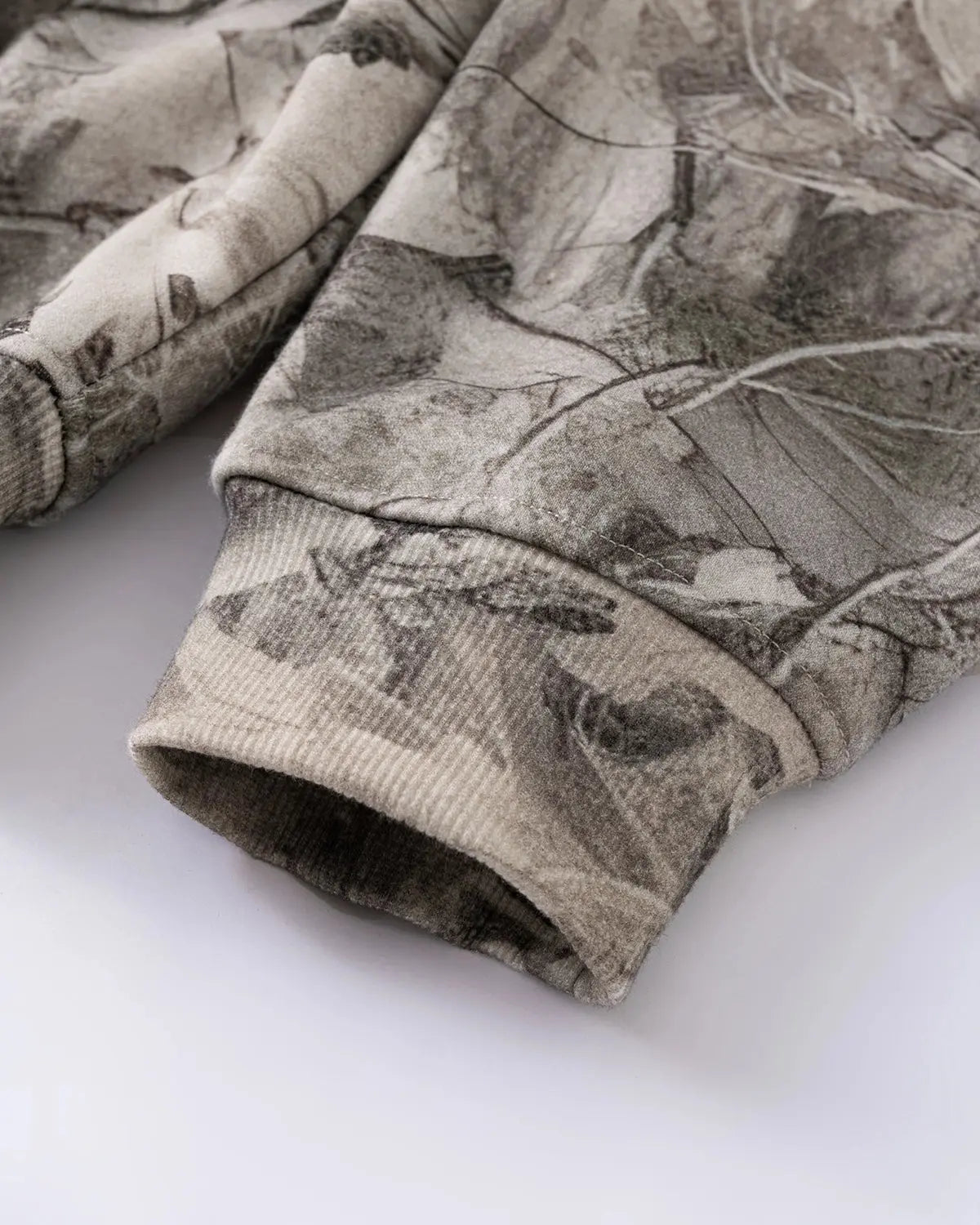 Realtree camo zip-up hoodie by Flation Streetwear featuring a camouflage pattern, hood, and full-length zipper.