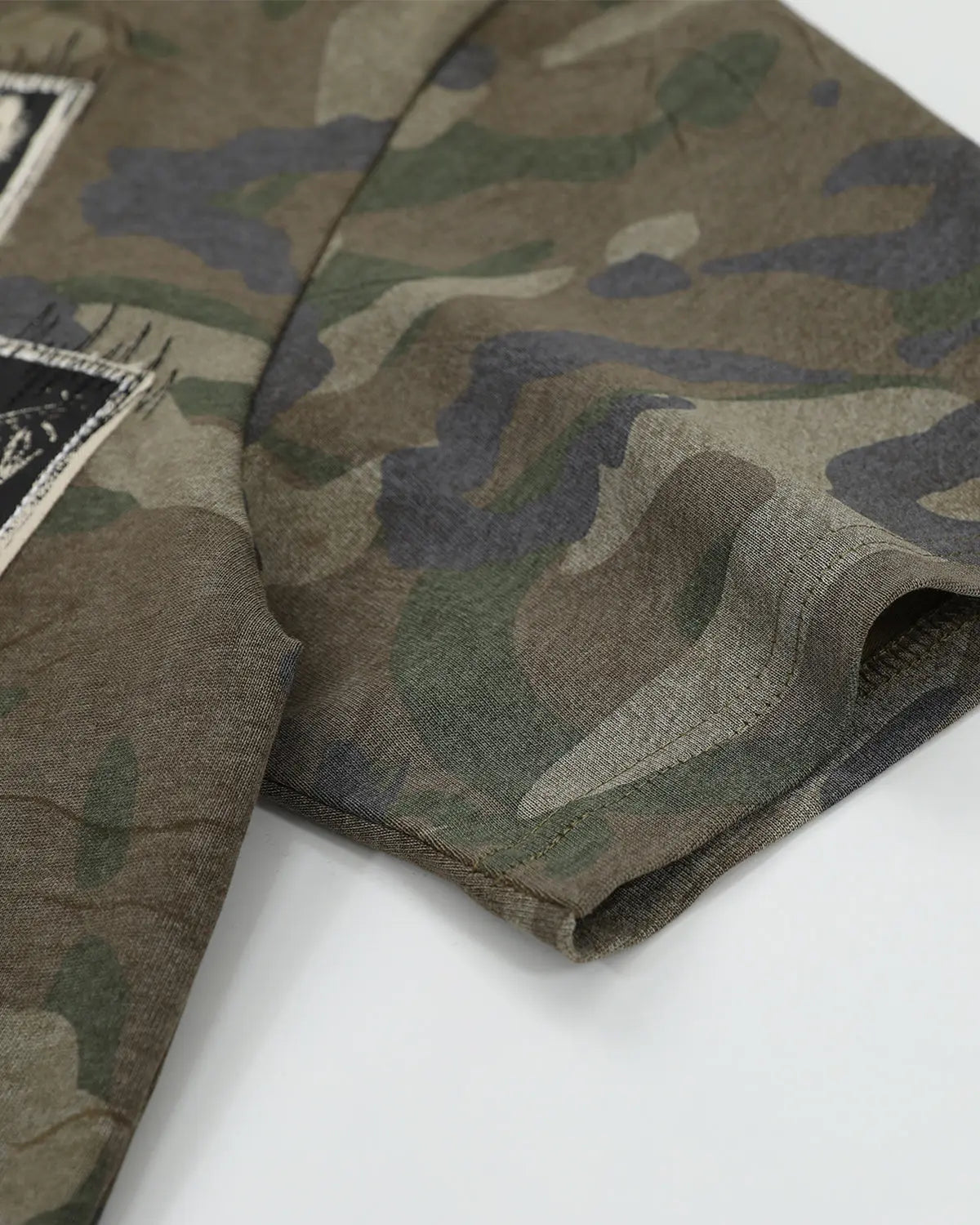 Vintage camo patch graphic T-shirt by Flation, featuring a stylish streetwear design with camouflage pattern and bold patch details.
