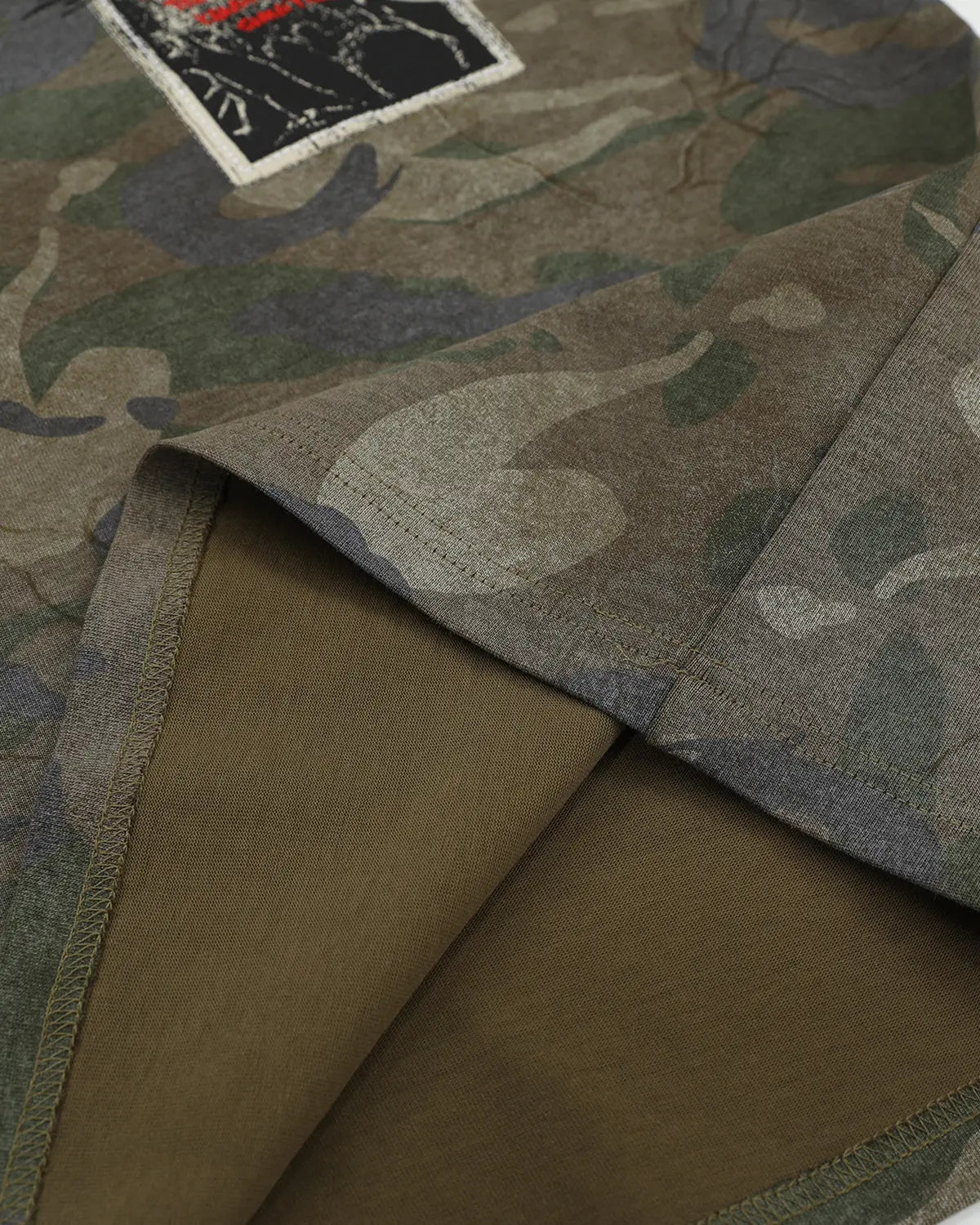 Vintage camo patch graphic T-shirt by Flation featuring military-inspired camouflage design and streetwear style.