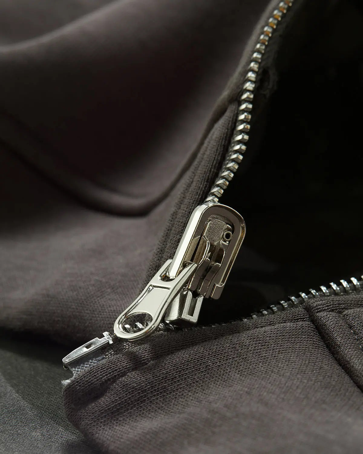 Camo reversible zip-up jacket by Flation Streetwear, showing both camo patterns and front zipper detail.