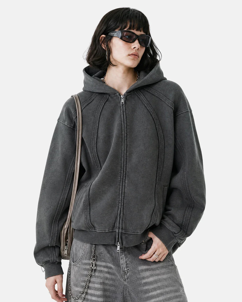 Dark grey Flation streetwear hoodie with snow-washed raw edges and a boxy zip-up design, front view.