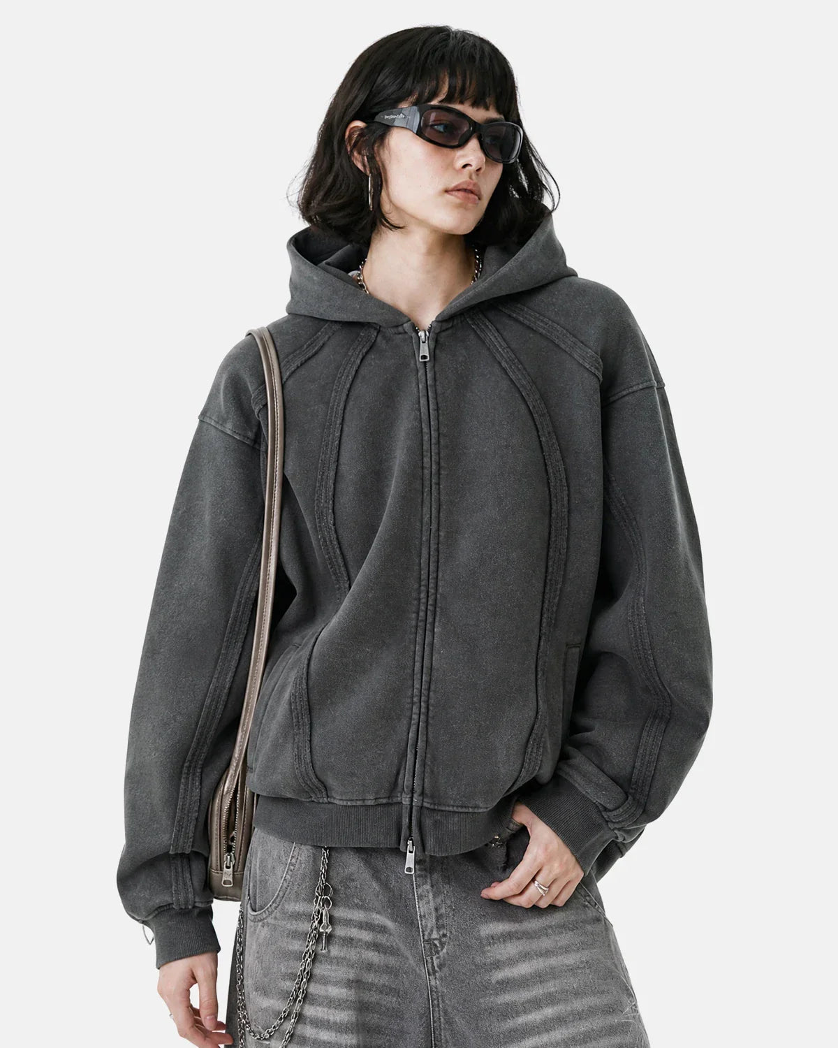 Dark grey Flation streetwear hoodie with snow-washed raw edges and a boxy zip-up design, front view.