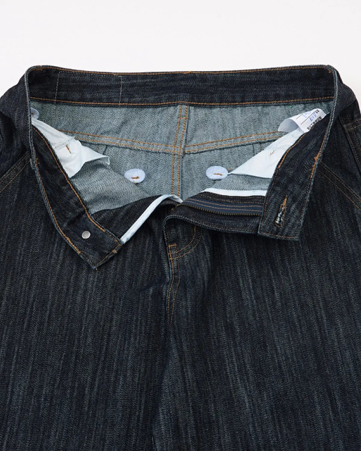 Dark indigo wide bootcut jeans by Flation Streetwear, shown on a model with a relaxed fit and classic denim style.