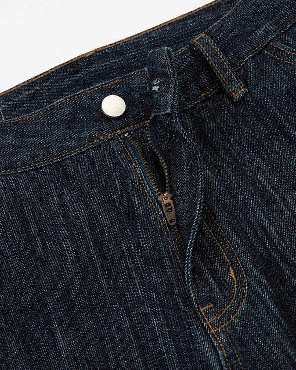 Dark indigo wide bootcut jeans by Flation Streetwear, shown on a model with a relaxed fit and classic denim style.