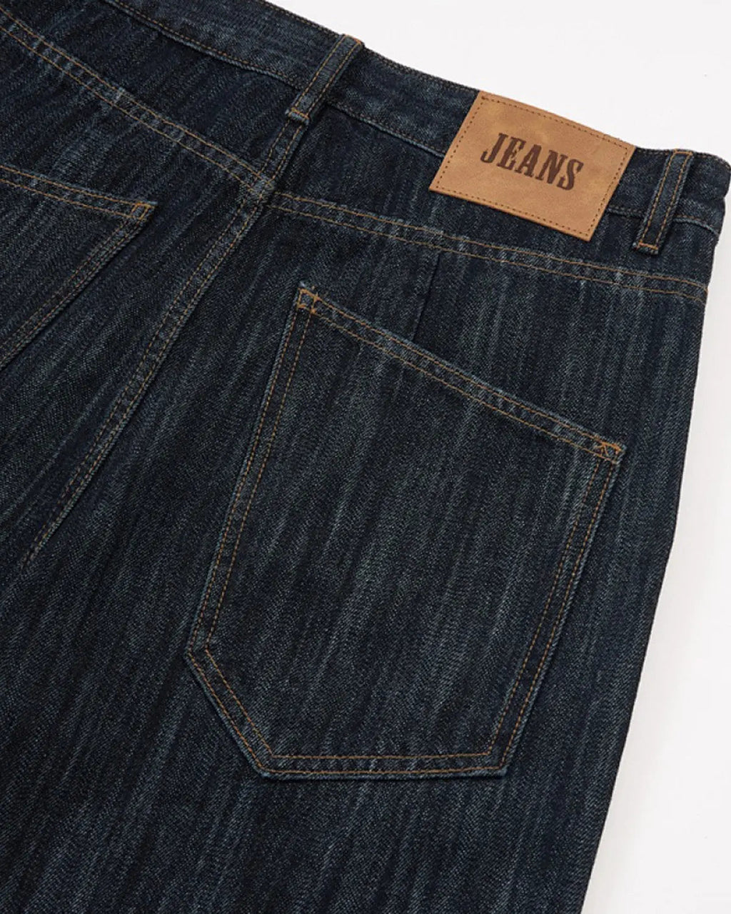 Dark indigo Flation wide bootcut jeans in size XS, shown on a model with a relaxed fit and classic denim style.
