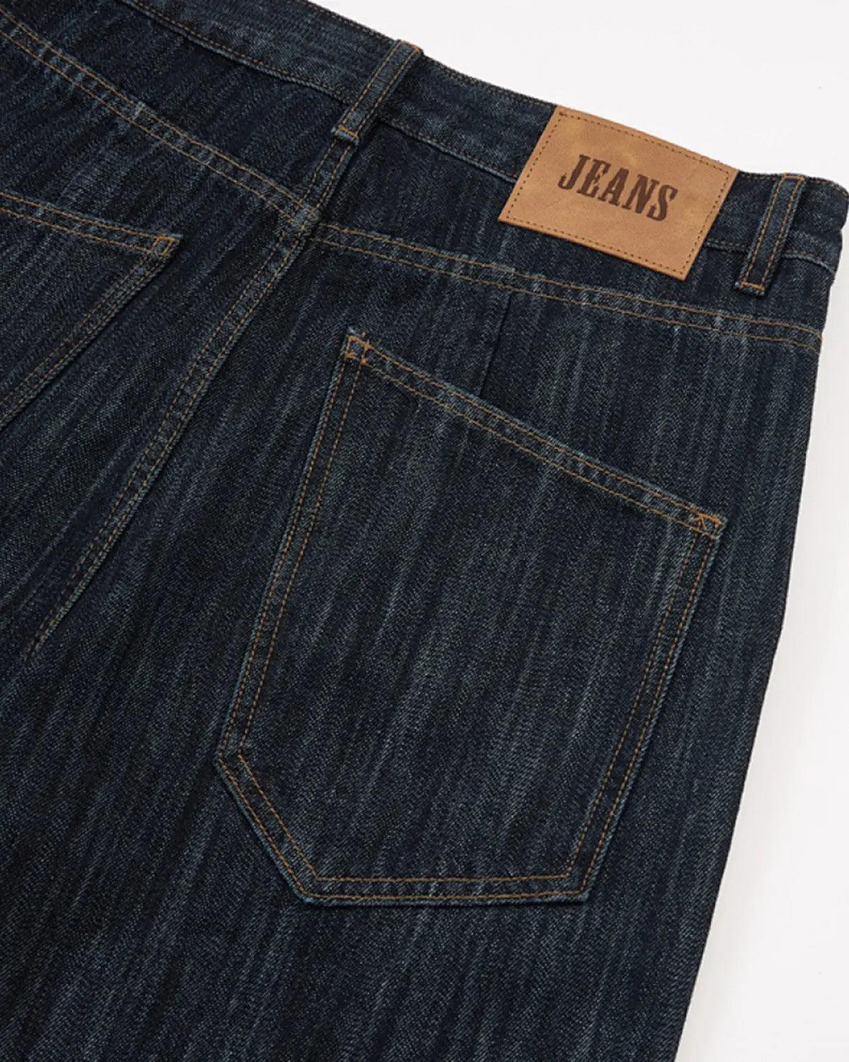 Dark indigo Flation wide bootcut jeans in size XS, shown on a model with a relaxed fit and classic denim style.
