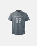 Gray distressed spray wash graphic T-shirt by Flation streetwear featuring a bold urban graphic design.