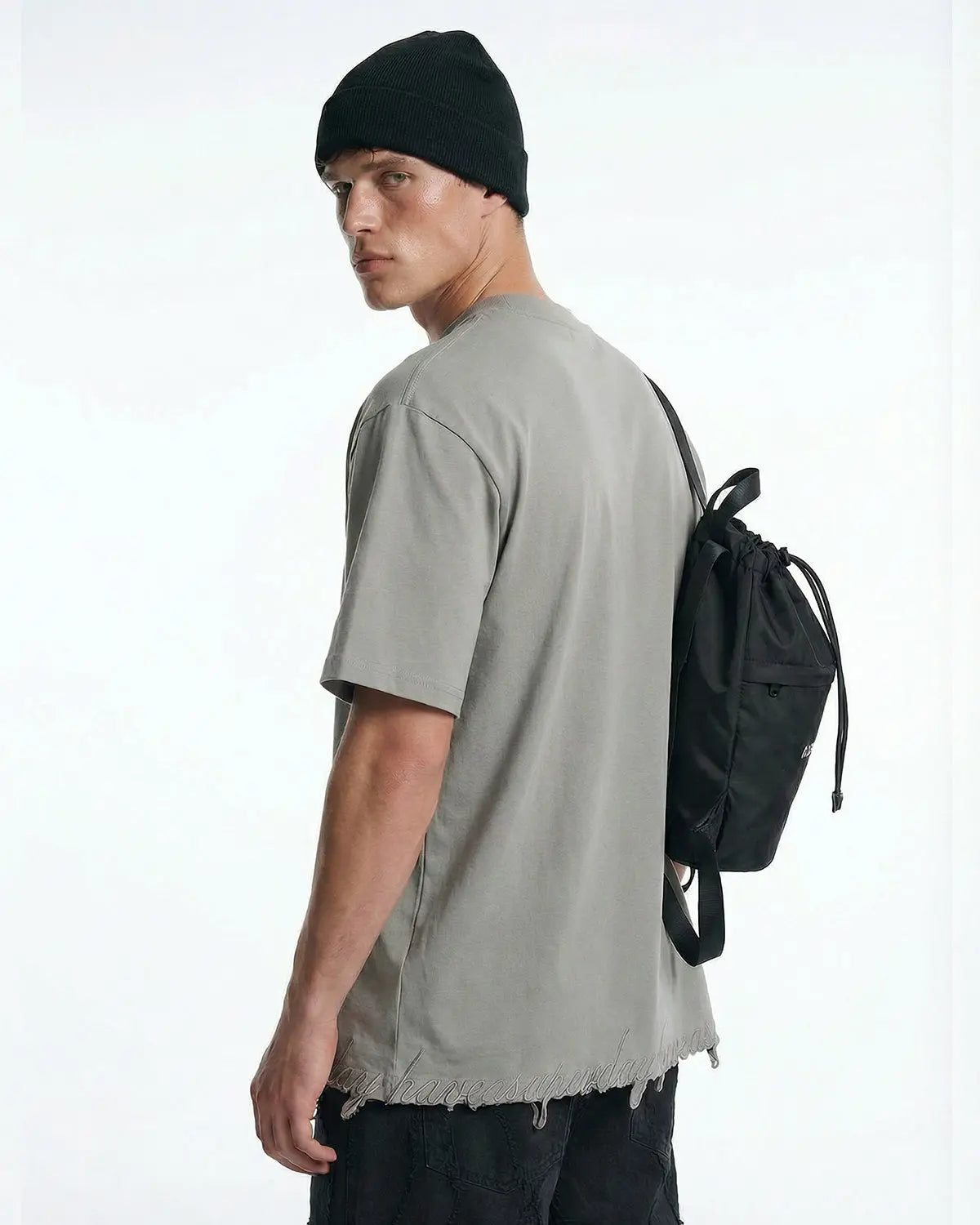 Grey oversized T-shirt by Flation with embroidered design and frayed hem, streetwear style, casual and comfortable fit.