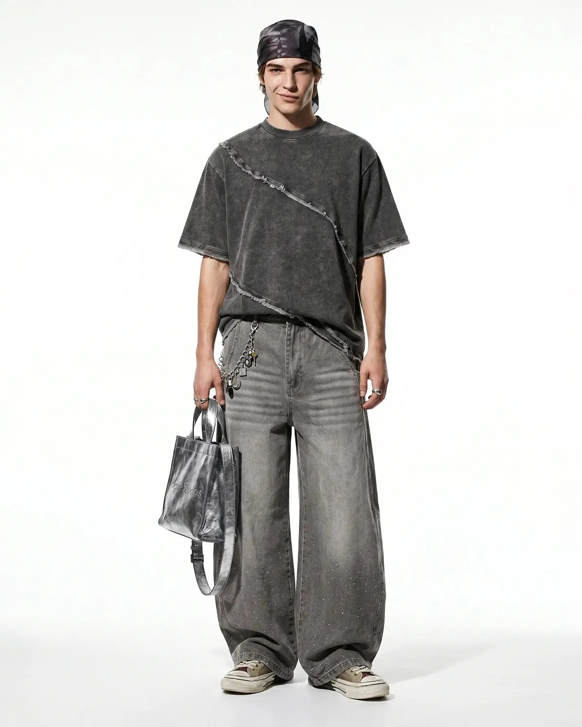 Raw edge deconstructed T-shirt from Inflation Streetwear with distressed fabric and casual fit, shown on a model.