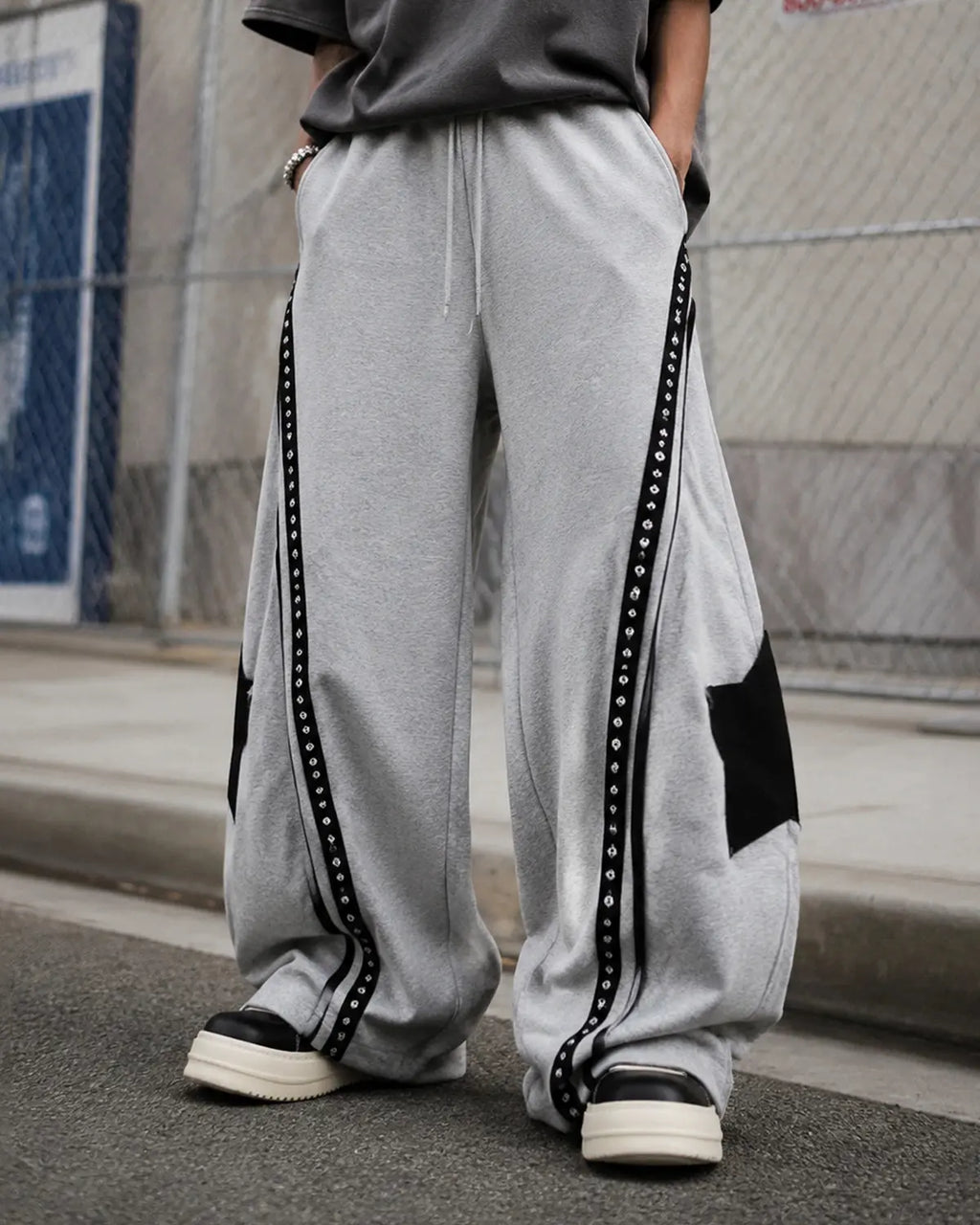 Grey contrast patchwork barrel sweatpants by Flation Streetwear featuring a relaxed fit and stylish design.