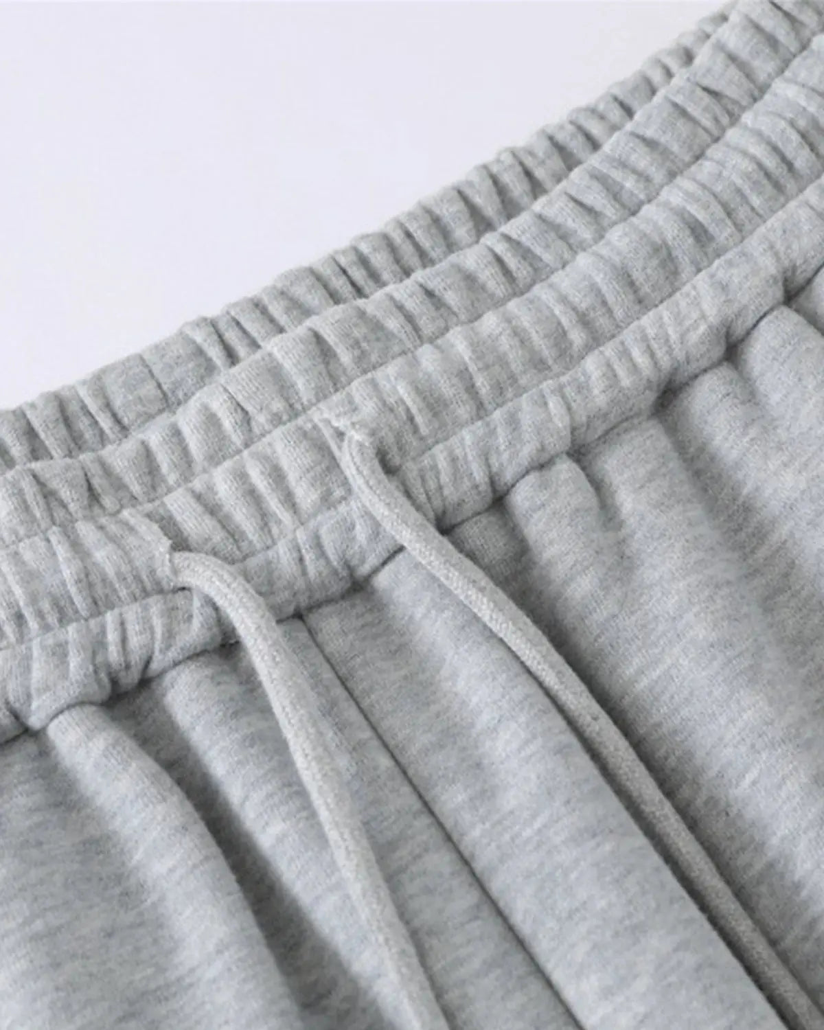Gray contrast patchwork barrel sweatpants by Flation Streetwear with relaxed fit and stylish design.