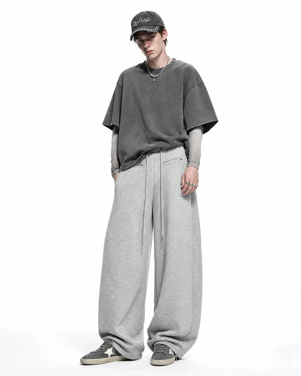Grey Flation curved wide-leg sweatpants with relaxed fit and elastic waistband, casual streetwear style.