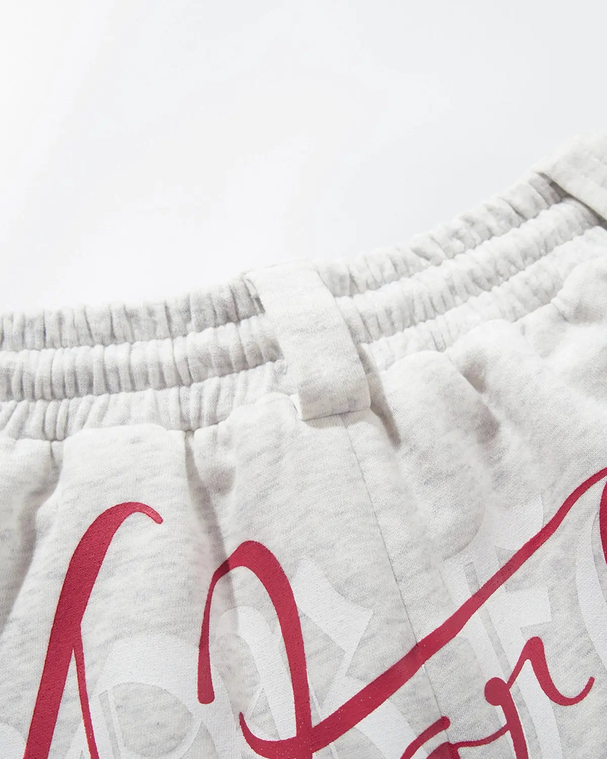 Grey Gothic Script Baggy Sweatpants by Flation Streetwear with relaxed fit and bold black lettering on the front.