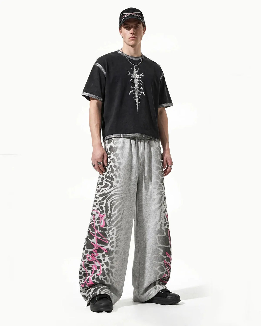 Leopard graphic barrel sweatpants by Flation featuring bold animal print and relaxed streetwear style.
