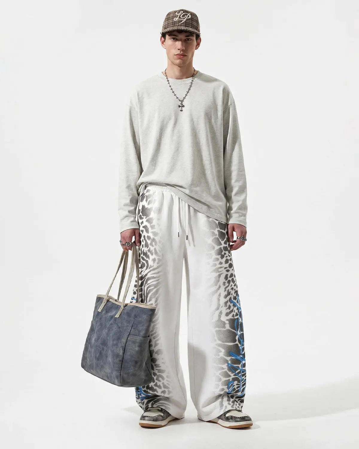 Leopard graphic barrel sweatpants by Flation Streetwear featuring a bold animal print design and relaxed fit.