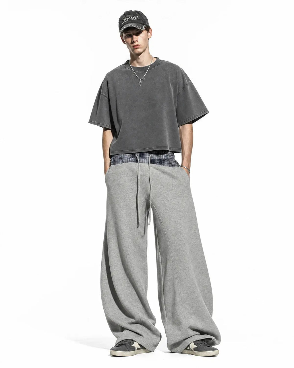 Plaid layered baggy sweatpants from INFLATION Streetwear with a relaxed fit and layered design, featuring a plaid pattern.