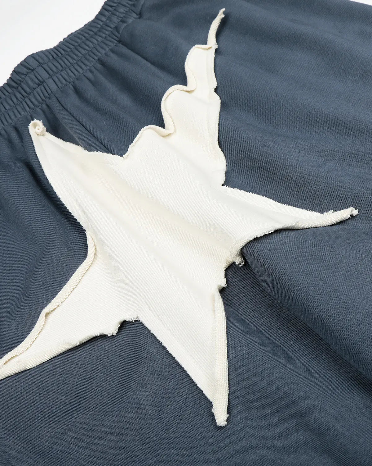 Grey Star Patch Baggy Wide-Leg Sweatpants by Flation with relaxed fit and streetwear style, featuring star patches on the fabric.
