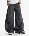Gray washed curved seam cargo pants by Flation Streetwear, featuring relaxed fit and multiple pockets on a model.