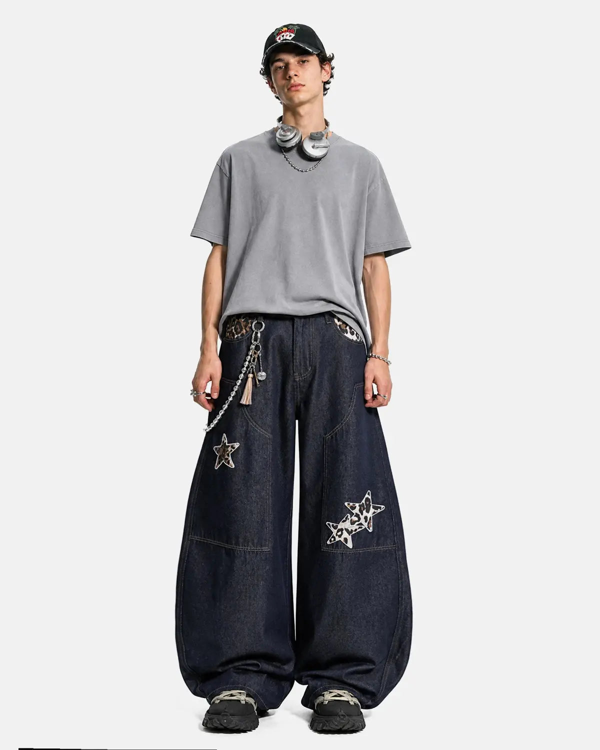 Inflation Streetwear leopard star patch barrel jeans showing the distressed denim with star patches and leopard print accents.